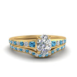 Load image into Gallery viewer, oval-shaped-graduated-channel-diamond-wedding-set-with-blue-topaz-in-FD122866OVGICBLTO-NL-YG

