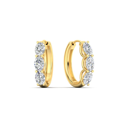 oval-shaped-huggie-hoops-3-stone-earrings-in-yellow-gold-fdear11727angle1-nl-yg_4f3c228c-6b63-4bc9-9e4f-3b5d1540acea.jpg?v=1776316096