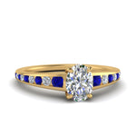 Load image into Gallery viewer, oval-shaped-swirl-engraved-channel-accent-diamond-engagement-ring-with-sapphire-in-FD122866OVRGSABL-NL-YG