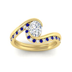 Load image into Gallery viewer, oval-shaped-swirl-sapphire-wedding-band-set-in-yellow-gold-fdens7806ovvtgsablangle5-nl-yg.jpg?v=1759991270
