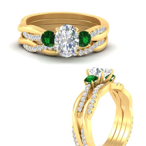oval-shaped-three-stone-twisted-emerald-wedding-band-in-yellow-gold-fdens3301ovgemgrangle3-nl-yg.jpg