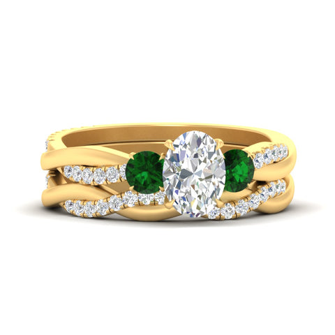 oval-shaped-three-stone-twisted-emerald-wedding-band-in-yellow-gold-fdens3301ovgemgrsleep-nl-yg.jpg