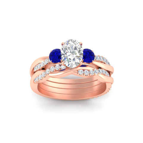 oval-shaped-three-stone-twisted-sapphire-wedding-band-in-rose-gold-fdens3301ovgsablangle5-nl-rg.jpg