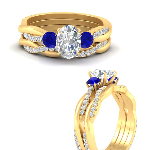 oval-shaped-three-stone-twisted-sapphire-wedding-band-in-yellow-gold-fdens3301ovgsablangle3-nl-yg.jpg