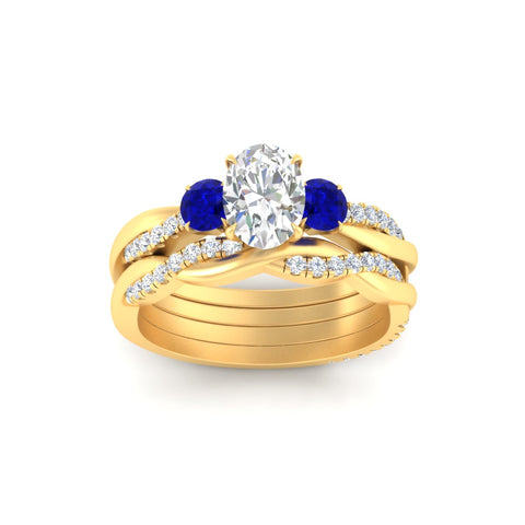 oval-shaped-three-stone-twisted-sapphire-wedding-band-in-yellow-gold-fdens3301ovgsablangle5-nl-yg.jpg