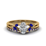 Load image into Gallery viewer, oval-shaped-twisted-diamond-bridal-set-with-blue-sapphire-in-14K-yellow-gold-FD8300OVGSABL-NL-YG.jpg
