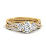 Load image into Gallery viewer, oval-shaped-twisted-floral-prong-diamond-wedding-set-in-yellow-gold-FD10257OV-NL-YG?v=1756360021
