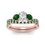 Load image into Gallery viewer, oval-shaped-twisted-floral-prong-emerald-wedding-set-in-rose-gold-FD10257OVGEMGR-ANGLE5-NL-RG_9af835f6-aaac-4ed8-8f9e-d1d21826e151?v=1756360148
