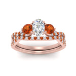 Load image into Gallery viewer, oval-shaped-twisted-floral-prong-orange-sapphire-wedding-set-in-rose-gold-FD10257OVGSAOR-ANGLE5-NL-RG_57a834f3-1a5b-4f8c-8955-2fb144c66c64?v=1756360148
