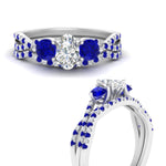 Load image into Gallery viewer, oval-shaped-twisted-floral-prong-sapphire-wedding-set-in-white-gold-FD10257OVGSABL-ANGLE3-NL-WG?v=1756360022
