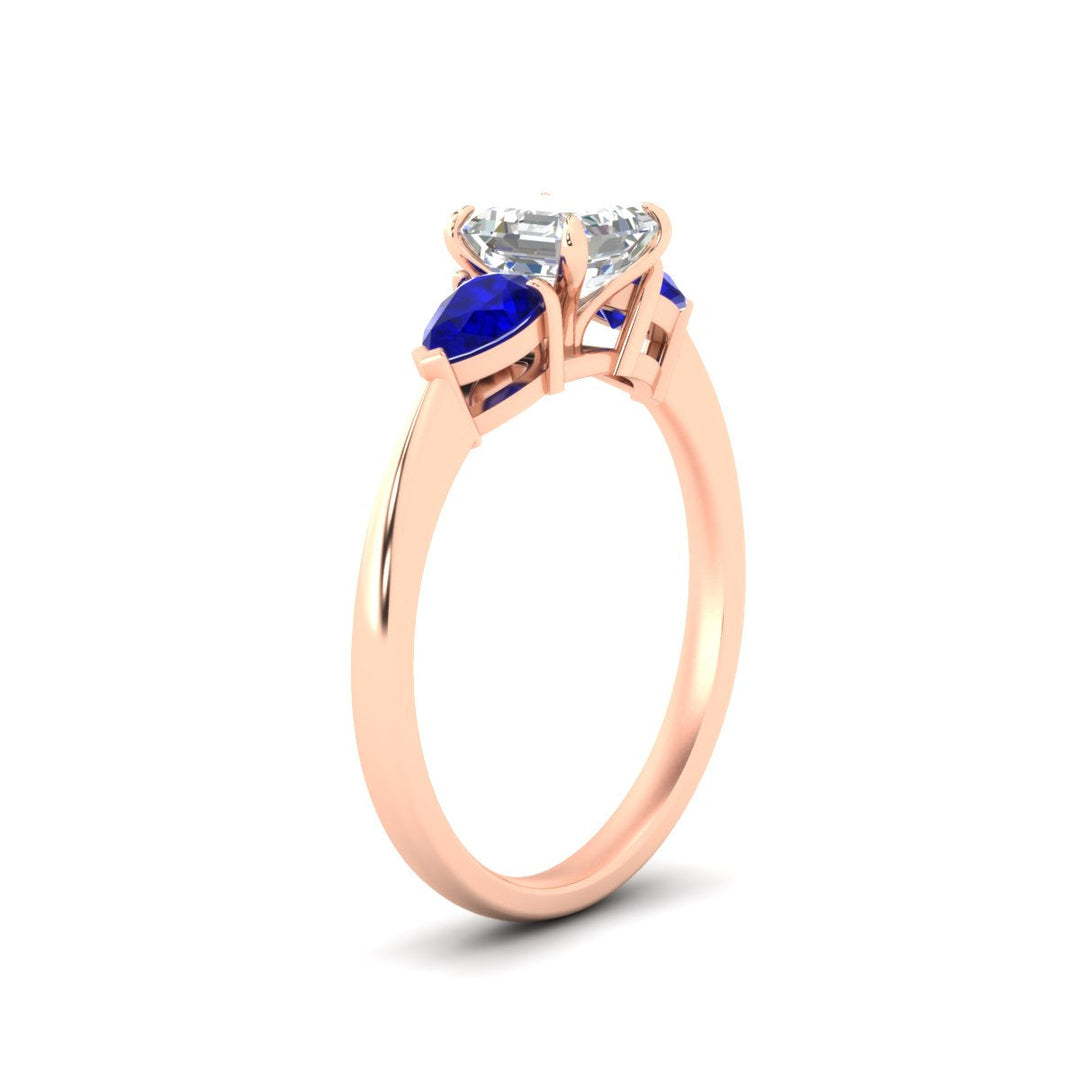 pear-diamond-cathedral-asscher-cut-engagement-ring-with-sapphire-in-rose-gold-fdenr9210asrgsablangle2-nl-rg.jpg?v=1758259331