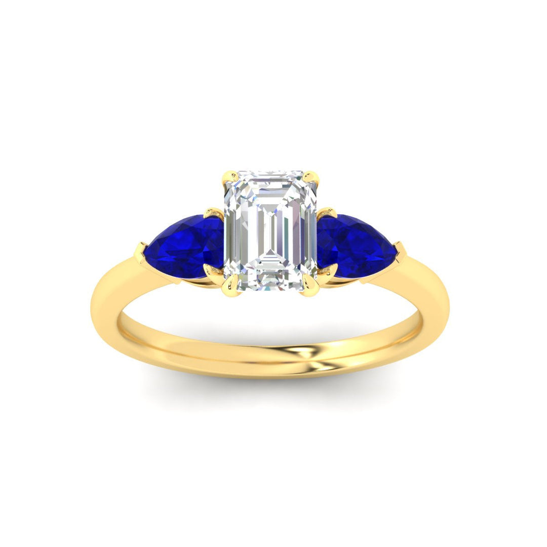 pear-diamond-cathedral-emerald-cut-engagement-ring-with-sapphire-in-yellow-gold-fdenr9210emrgsablangle5-nl-yg.jpg?v=1758097711