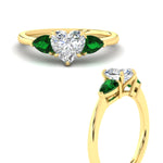 Load image into Gallery viewer, pear-diamond-cathedral-heart-shaped-engagement-ring-with-emerald-in-yellow-gold-fdenr9210htrgemgrangle3-nl-yg
