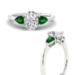 Load image into Gallery viewer, pear-diamond-cathedral-oval-shaped-engagement-ring-with-emerald-in-white-gold-fdenr9210ovrgemgrangle3-nl-wg.jpg?v=1758087322
