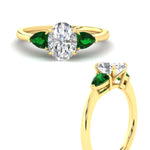 Load image into Gallery viewer, pear-diamond-cathedral-oval-shaped-engagement-ring-with-emerald-in-yellow-gold-fdenr9210ovrgemgrangle3-nl-yg.jpg?v=1758087322
