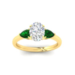 Load image into Gallery viewer, pear-diamond-cathedral-oval-shaped-engagement-ring-with-emerald-in-yellow-gold-fdenr9210ovrgemgrangle5-nl-yg.jpg?v=1758087322
