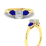 Load image into Gallery viewer, pear-diamond-cathedral-princess-cut-engagement-ring-with-sapphire-in-yellow-gold-fdenr9210prrgsablangle3-nl-yg.jpg?v=1758084928
