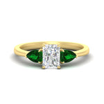 Load image into Gallery viewer, pear-diamond-cathedral-radiant-cut-engagement-ring-with-emerald-in-yellow-gold-fdenr9210rargemgrsleep-nl-yg
