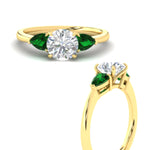 Load image into Gallery viewer, pear-diamond-cathedral-round-cut-engagement-ring-with-emerald-in-yellow-gold-fdenr9210rorgemgrangle3-nl-yg
