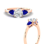 Load image into Gallery viewer, pear-diamond-cathedral-round-cut-engagement-ring-with-sapphire-in-rose-gold-fdenr9210rorgsablangle3-nl-rg

