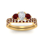 Load image into Gallery viewer, pear-shaped-twisted-floral-prong-ruby-wedding-set-in-yellow-gold-FD10257PEGRUDR-ANGLE5-NL-YG?v=1756360037
