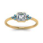 Load image into Gallery viewer, petite-bezel-set-asscher-cut-diamond-engagement-ring-with-blue-topaz-in-yellow-gold-FD9175ASRGICBLTOANGLE5-NL-YG
