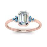Load image into Gallery viewer, petite-bezel-set-emerald-cut-diamond-engagement-ring-with-blue-topaz-in-rose-gold-FD9175EMRGICBLTOANGLE5-NL-RG
