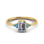 Load image into Gallery viewer, petite-bezel-set-emerald-cut-diamond-engagement-ring-with-blue-topaz-in-yellow-gold-FD9175EMRGICBLTO-NL-YG
