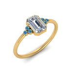 Load image into Gallery viewer, petite-bezel-set-emerald-cut-diamond-engagement-ring-with-blue-topaz-in-yellow-gold-FD9175EMRGICBLTOANGLE2-NL-YG
