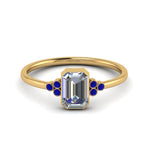 Load image into Gallery viewer, petite-bezel-set-emerald-cut-diamond-engagement-ring-with-sapphire-in-yellow-gold-FD9175EMRGSABL-NL-YG
