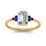 Load image into Gallery viewer, petite-bezel-set-emerald-cut-diamond-engagement-ring-with-sapphire-in-yellow-gold-FD9175EMRGSABLANGLE5-NL-YG
