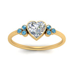 Load image into Gallery viewer, petite-bezel-set-heart-shaped-diamond-engagement-ring-with-blue-topaz-in-yellow-gold-FD9175HTRGICBLTOANGLE5-NL-YG
