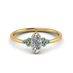 Load image into Gallery viewer, petite-bezel-set-marquise-cut-diamond-engagement-ring-with-blue-topaz-in-yellow-gold-FD9175MQRGICBLTO-NL-YG

