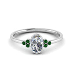 Load image into Gallery viewer, petite-bezel-set-oval-shaped-diamond-engagement-ring-with-emerald-in-white-gold-FD9175OVRGEMGR-NL-WG

