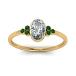 Load image into Gallery viewer, petite-bezel-set-oval-shaped-diamond-engagement-ring-with-emerald-in-yellow-gold-FD9175OVRGEMGRANGLE5-NL-YG

