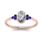 Load image into Gallery viewer, petite-bezel-set-oval-shaped-diamond-engagement-ring-with-sapphire-in-rose-gold-FD9175OVRGSABLANGLE5-NL-RG

