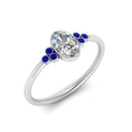 Load image into Gallery viewer, petite-bezel-set-oval-shaped-diamond-engagement-ring-with-sapphire-in-white-gold-FD9175OVRGSABLANGLE2-NL-WG
