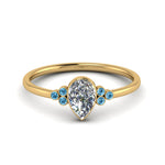 Load image into Gallery viewer, petite-bezel-set-pear-shaped-diamond-engagement-ring-with-blue-topaz-in-yellow-gold-FD9175PERGICBLTO-NL-YG
