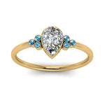 Load image into Gallery viewer, petite-bezel-set-pear-shaped-diamond-engagement-ring-with-blue-topaz-in-yellow-gold-FD9175PERGICBLTOANGLE5-NL-YG
