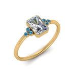Load image into Gallery viewer, petite-bezel-set-radiant-cut-diamond-engagement-ring-with-blue-topaz-in-yellow-gold-FD9175RARGICBLTOANGLE2-NL-YG
