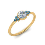 Load image into Gallery viewer, petite-bezel-set-round-cut-diamond-engagement-ring-with-blue-topaz-in-yellow-gold-FD9175RORGICBLTOANGLE2-NL-YG
