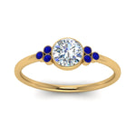 Load image into Gallery viewer, petite-bezel-set-round-cut-diamond-engagement-ring-with-sapphire-in-yellow-gold-FD9175RORGSABLANGLE5-NL-YG
