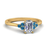 Load image into Gallery viewer, petite-cathedral-emerald-cut-diamond-engagement-ring-with-blue-topaz-in-yellow-gold-FD9275EMRGICBLTO-NL-YG_bb727af0-3ca1-4e52-a006-fb5fc58e174e?v=1758264056
