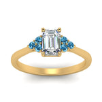 Load image into Gallery viewer, petite-cathedral-emerald-cut-diamond-engagement-ring-with-blue-topaz-in-yellow-gold-FD9275EMRGICBLTOANGLE5-NL-YG_f367ce2c-ca8d-4207-a694-1aa9292a0a6c?v=1758264057
