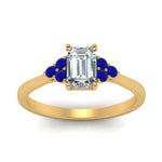 Load image into Gallery viewer, petite-cathedral-emerald-cut-diamond-engagement-ring-with-sapphire-in-yellow-gold-FD9275EMRGSABLANGLE5-NL-YG_60967694-c56f-4f9e-a8d0-545e44edd550?v=1758264056
