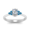 Load image into Gallery viewer, petite-cathedral-oval-shaped-diamond-engagement-ring-with-blue-topaz-in-white-gold-FD9275OVRGICBLTOANGLE5-NL-WG_894e863b-767e-4d39-a984-7d1c18336d43?v=1758264078