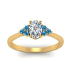 Load image into Gallery viewer, petite-cathedral-oval-shaped-diamond-engagement-ring-with-blue-topaz-in-yellow-gold-FD9275OVRGICBLTOANGLE5-NL-YG_8a5ec666-8834-47f3-abfa-f55201512c24?v=1758264078