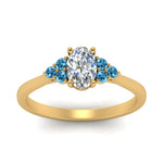 Load image into Gallery viewer, petite-cathedral-oval-shaped-diamond-engagement-ring-with-blue-topaz-in-yellow-gold-FD9275OVRGICBLTOANGLE5-NL-YG_8a5ec666-8834-47f3-abfa-f55201512c24?v=1758264078
