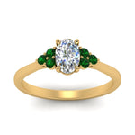 Load image into Gallery viewer, petite-cathedral-oval-shaped-diamond-engagement-ring-with-emerald-in-yellow-gold-FD9275OVRGEMGRANGLE5-NL-YG_ef50e751-9c34-4fa6-91ee-aacfce8e5139?v=1758264078
