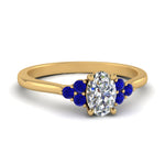 Load image into Gallery viewer, petite-cathedral-oval-shaped-diamond-engagement-ring-with-sapphire-in-yellow-gold-FD9275OVRGSABL-NL-YG_debdc474-0ae2-4d09-ae83-c9c59f91ae40?v=1758264077

